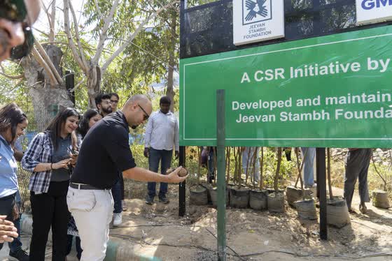 A coconut for a good start, at the site board.