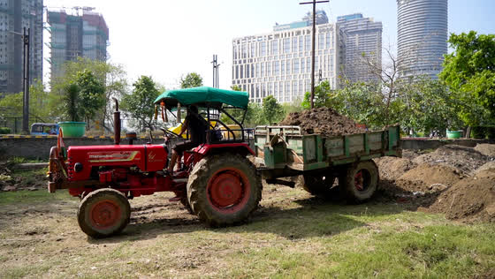 Fresh soil arriving by tractor.
